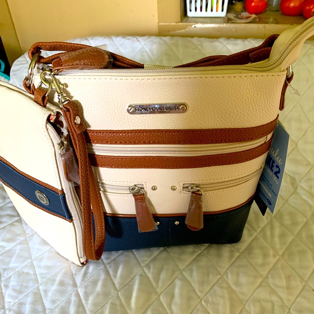 Great crossbody bag W/ built in phone charger NWT
